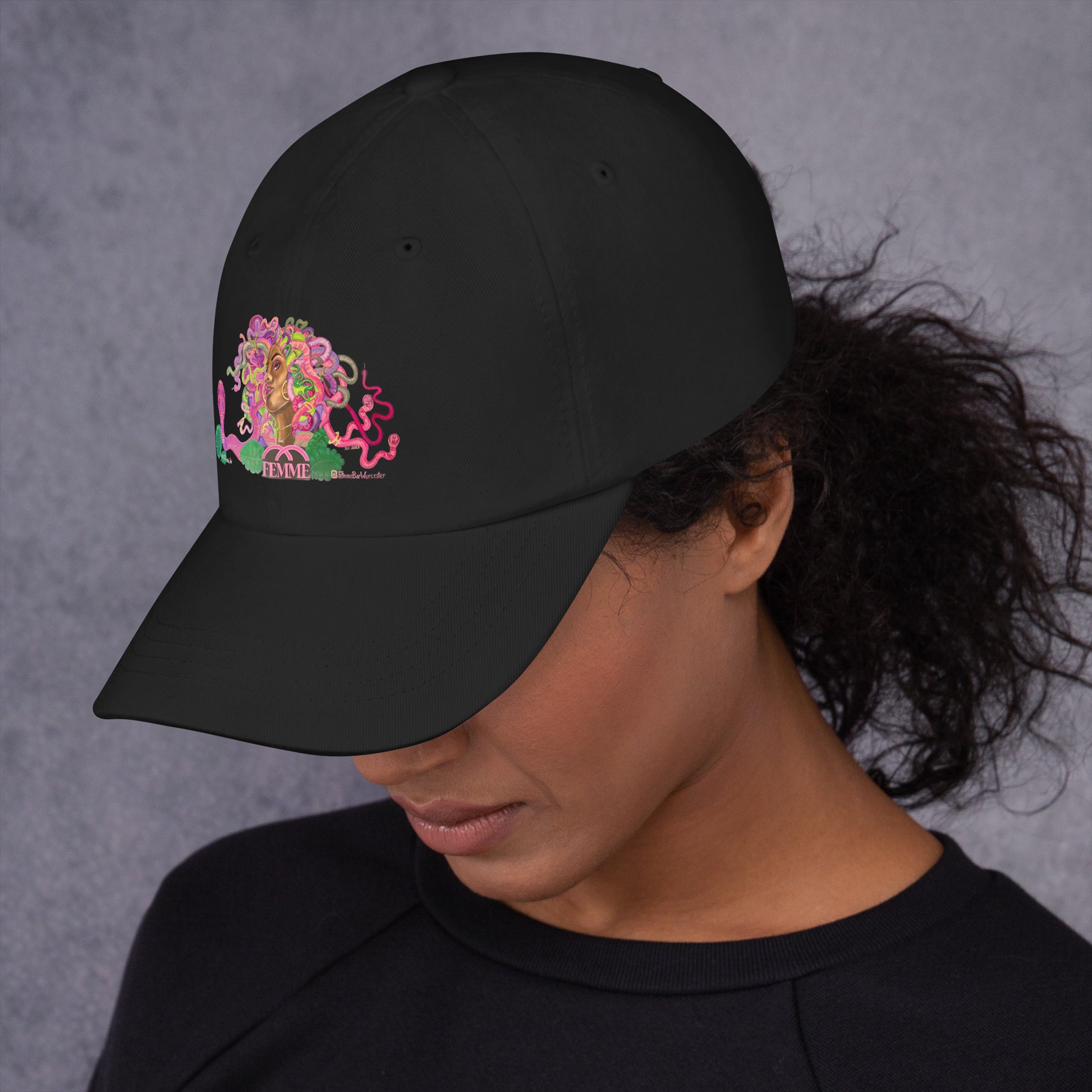 Person wearing Femme Mural dad hat Femme Bar lesbian bar merch Worcester MA